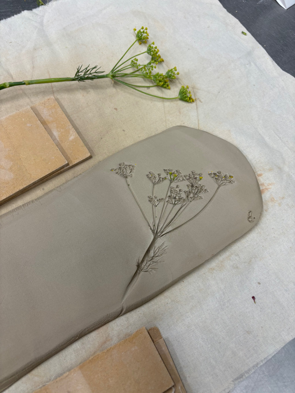 Flower imprint in clay during the making of Flora Aeterna